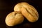 Small bread rolls, brÃ¶tchen - breakfast rolls - on dark background