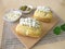 Small breads with herb cheese topping