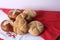 Small breads over a red and white cloths