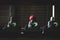 Small bronze buddhist statues with coin and knitted red hat offerings in Daisho-in temple in Miyajima, Hiroshima, Japan