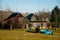 Small brown house, Old wooden timber hut with a fence, Cottage surrounded by trees, Bohemian Paradise, rock formation Besednicke