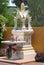 Small Buddhist Shrine in front of Building