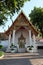 A small Buddhist shrine with a luxuriously decorated roof