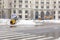 Small bulldozer clearing the snow off the road 