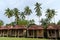 Small bungalows near palm trees