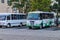 Small buses are waiting at a Bus station in Merida