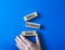 Small Business Ideas symbol. Wooden blocks with words Small Business Ideas. Businessman hand. Beautiful blue background. Business