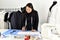 Small business owner, Dressmaker designer making pattern and measure garment.