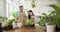 Small Business Owners, a Man and a Woman, Arrange Plants in a Bright Indoor Garden