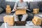 Small business parcel for shipping, Happy man opening online shopping package box with parcel while sitting on sofa at home