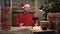 Small business start-up owner Santa Claus works from home in the office. Online Christmas sale. a man takes an order by