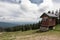 A small cabin near the older double chairlifts at Seymour Mountain with scenic view in the background