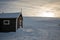 A small cabin in winter landscape at Svalbard