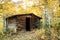 Small cabin in the woods in Autumn