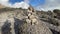 Small cairn. Beautiful mountain landscape. Blue sky with white clouds.