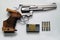 Small caliber Smith and Wesson revolver sports weapon with associated ammunition