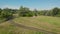 A small camp in the fields. Tourists stopped in a beautiful natural place with three tents, cook food and go away.