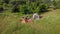 A small camp in the fields. Tourists stopped in a beautiful natural place with three tents, cook food and go away.