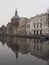 Small canal with reflection of the Marekerk church in the water