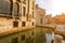 Small canal in Venice with old buildings balconies a fading painted walls