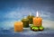 Small candles with beeswax on a blue background