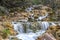 Small cascades of waterfalls on a mountain stream in the spring. Parod River. Israel