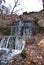 A small cascading waterfall in a city park