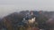 A small castle on the mountain during foggy weather. Castle standing on the hill in Kiev