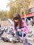 Small caucasian girl and pigeons