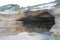 Small Cave in a Cliff by a Beach