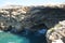 Small caves of the rocky Mediterranean coast. Triq Tal-Prajjet, Il-Mellieha, Malta.