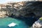 Small caves of the rocky Mediterranean coast. Triq Tal-Prajjet, Il-Mellieha, Malta.