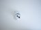 Small CCTV camera security mounted on the ceiling