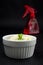 Small Celery Indoor Regrowth in White Bowl with Red Water Bottle Spray