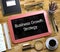 Small Chalkboard with Business Growth Strategy. 3d