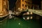 Small channel and bridges in lagoon city venice at night. long e