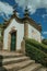 Small chapel in baroque style next to stone staircase