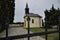 A small chapel at the cemetery in Jacovce near Topolcany, Slovakia, Europe. Gate to the small church. Roman Catholic Church
