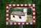 Small chapel reflected in a roadside convex safety mirror near Heiligenblut am Grossglockner, Austria.