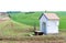 Small chapel in spectacular green wavy moravian fields and highl