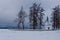 Small Chapel in winter landscape.