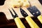 Small cheese knives and chopping board with emmenthal cheese on