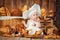 Small child cooks a croissant in the background of baskets with rolls and bread.