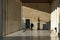 small child crawls in a building with Doric columns, Stoa Attalou, Athens