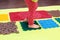 Small child with a flat-bottomed stomach goes barefoot on an orthopedic foot mat for the appointment of an orthopedist. gymnastics