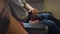 A small child indulges in an airplane with a seat belt in an airplane.