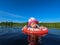 small child kid baby inflatable circle in river in the water. summer vacation