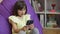 Small child learning in cellphone, watching video, having fun with mobile technology concept. Cute kid girl holding