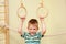 Small child playing sports at sport center