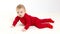 Small child in red clothes crawls on the floor